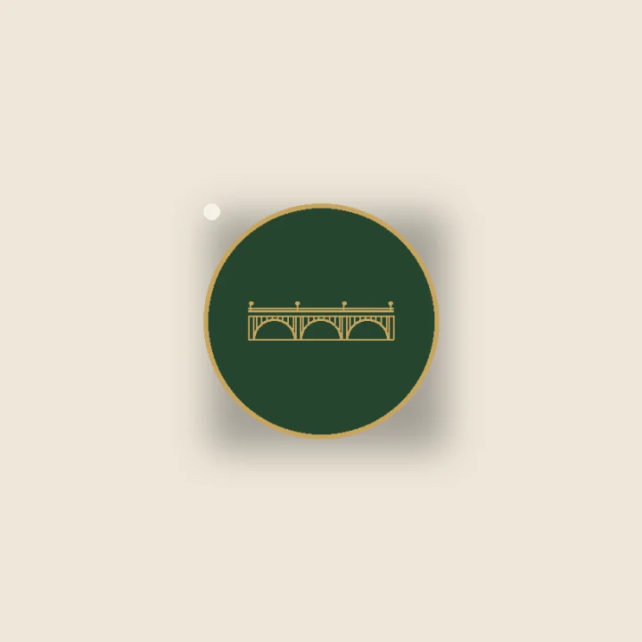 Hard-enamel keystone-arch lapel pin in gold and green