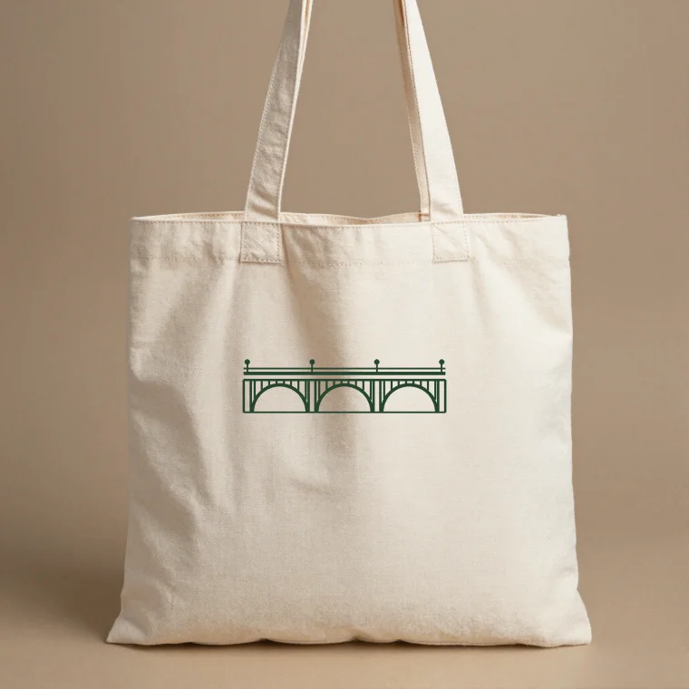 Natural canvas tote with the green bridge crest
